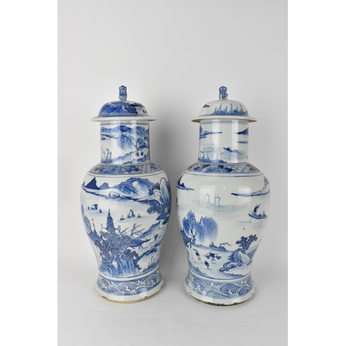 84 - A pair of Chinese Qing dynasty blue and white porcelain lidded vases, 19th century, of baluster shap... 