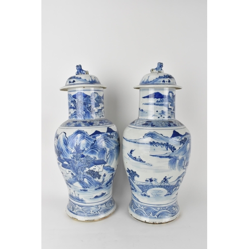 84 - A pair of Chinese Qing dynasty blue and white porcelain lidded vases, 19th century, of baluster shap... 