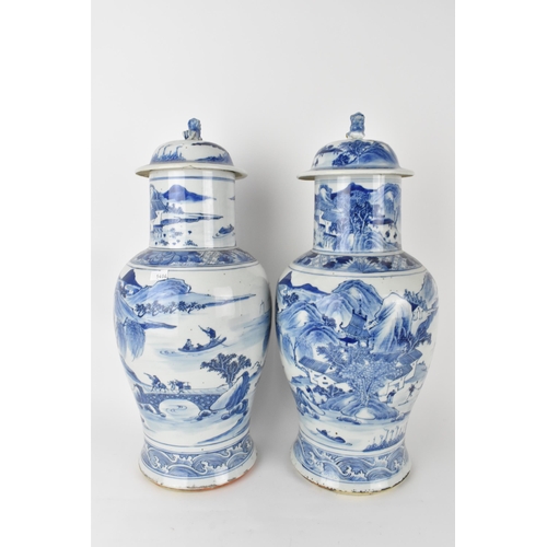 84 - A pair of Chinese Qing dynasty blue and white porcelain lidded vases, 19th century, of baluster shap... 