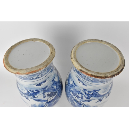 84 - A pair of Chinese Qing dynasty blue and white porcelain lidded vases, 19th century, of baluster shap... 