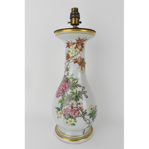 86 - A Japanese Meiji period porcelain vase of baluster shape, with a flared rim, ring neck and splayed f... 