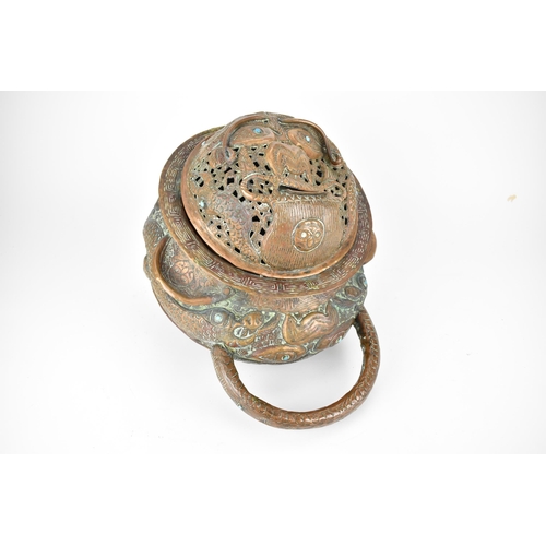 96 - A late 19th/early 20th century Tibetan incense burner, with turquoise cabochons, carrying handles an... 