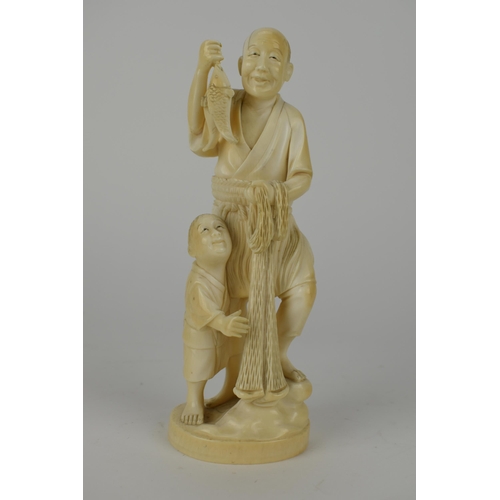 98 - A Japanese Meiji period ivory Okimono of a fisherman holding two fish and a net with a boy by his si... 