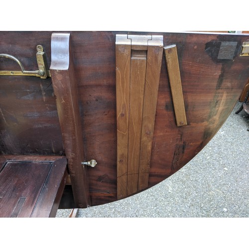 160 - A late 19th/early 20th century Regency design mahogany dining table with D-shaped ends, over cannon ... 