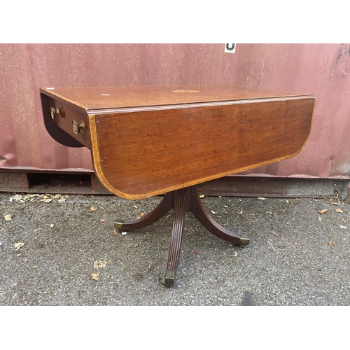 153 - A Regency mahogany and marquetry Pembroke table, the top with fall flaps and a crossbanded border, o... 