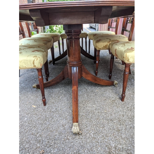 160 - A late 19th/early 20th century Regency design mahogany dining table with D-shaped ends, over cannon ... 