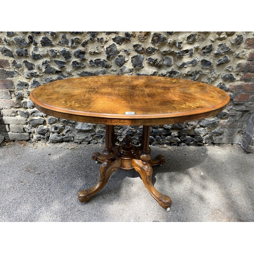 175 - A mid Victorian walnut and marquetry loo table, over turned, fluted columns, on carved splayed legs ... 