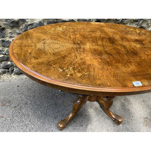 175 - A mid Victorian walnut and marquetry loo table, over turned, fluted columns, on carved splayed legs ... 