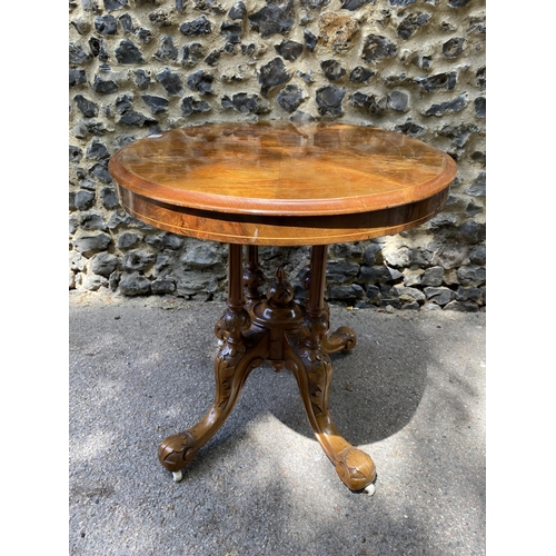 175 - A mid Victorian walnut and marquetry loo table, over turned, fluted columns, on carved splayed legs ... 