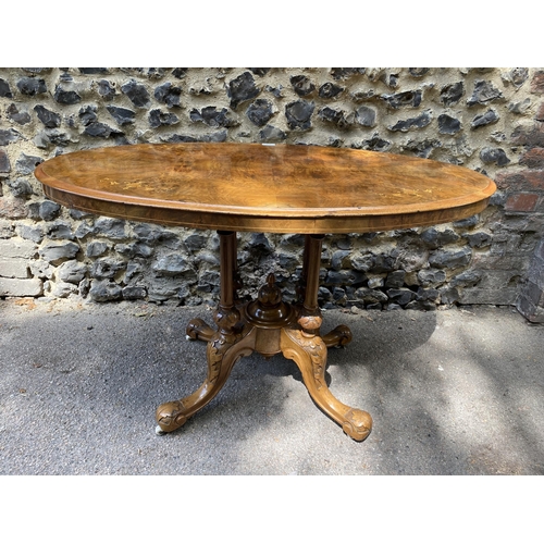 175 - A mid Victorian walnut and marquetry loo table, over turned, fluted columns, on carved splayed legs ... 