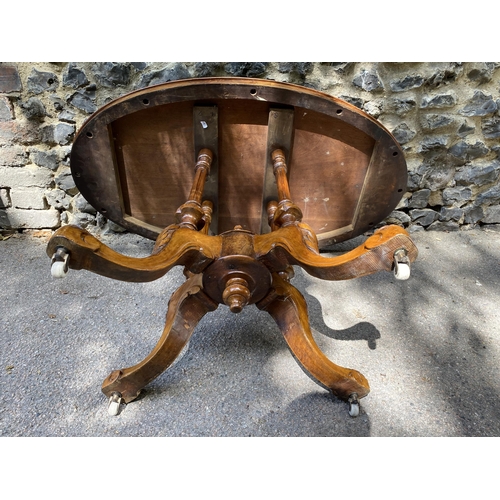 175 - A mid Victorian walnut and marquetry loo table, over turned, fluted columns, on carved splayed legs ... 