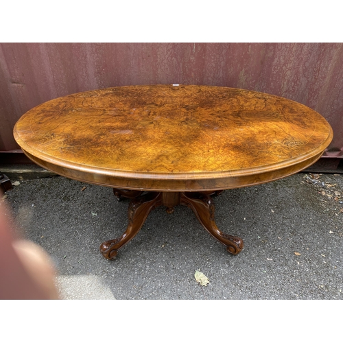 178 - A late Victorian figured walnut and marquetry loo table with an oval tip top, over a bulbous carved ... 