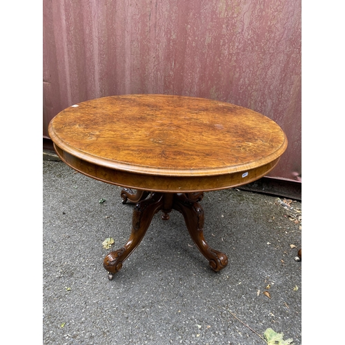 178 - A late Victorian figured walnut and marquetry loo table with an oval tip top, over a bulbous carved ... 