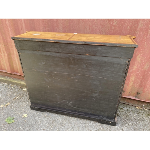 180 - A late Victorian mixed veneer and marquetry cabinet with gilt metal mounts, a pair of panelled doors... 