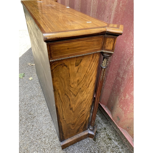 180 - A late Victorian mixed veneer and marquetry cabinet with gilt metal mounts, a pair of panelled doors... 