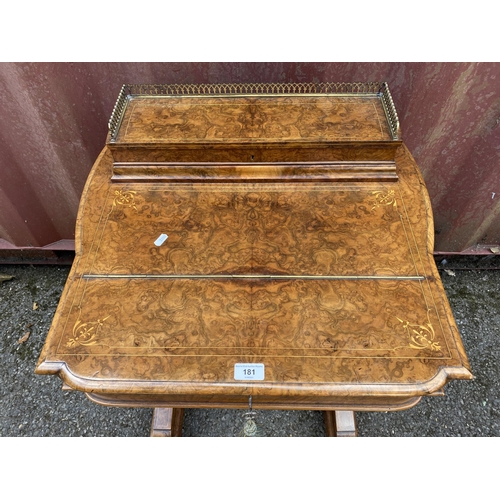 181 - A late Victorian figured walnut and marquetry Davenport, the box top with a hinged lid and gilt meta... 