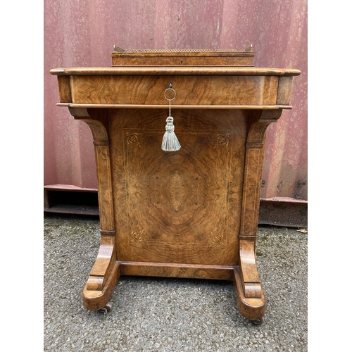 181 - A late Victorian figured walnut and marquetry Davenport, the box top with a hinged lid and gilt meta... 