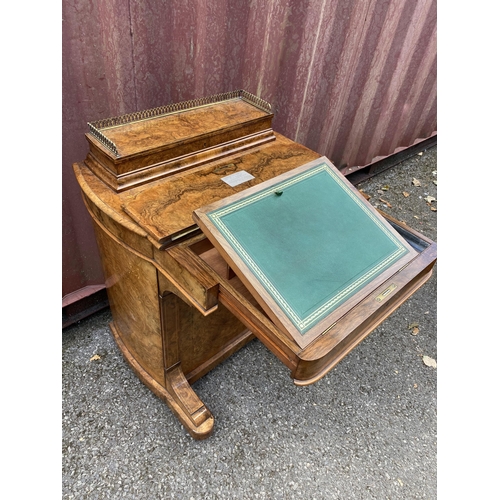 181 - A late Victorian figured walnut and marquetry Davenport, the box top with a hinged lid and gilt meta... 