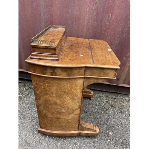 181 - A late Victorian figured walnut and marquetry Davenport, the box top with a hinged lid and gilt meta... 