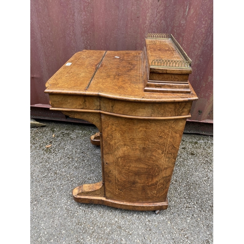 181 - A late Victorian figured walnut and marquetry Davenport, the box top with a hinged lid and gilt meta... 