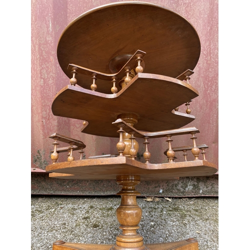 182 - A late Victorian walnut book table with brass and marquetry ornament, over two tiers with spindle ga... 