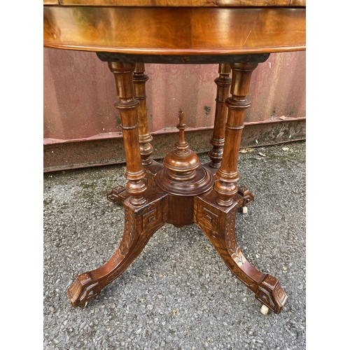 185 - A late Victorian figured walnut and marquetry demi-lune card table, over turned columns, on splayed ... 