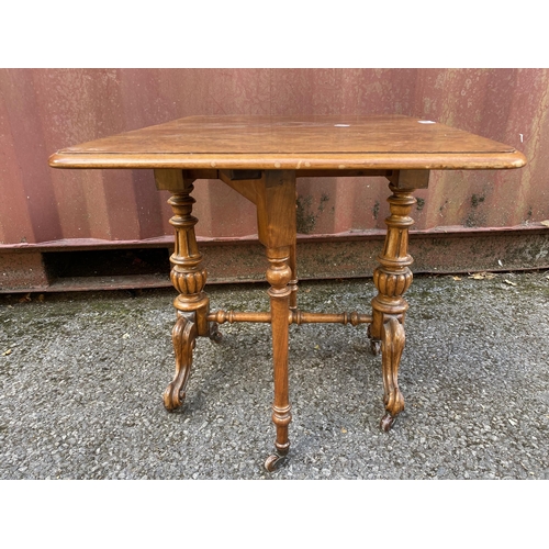 186 - A late Victorian figured walnut Sutherland table of small proportions, with twin fall flaps, twin ca... 