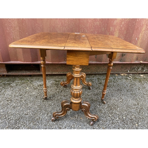 186 - A late Victorian figured walnut Sutherland table of small proportions, with twin fall flaps, twin ca... 