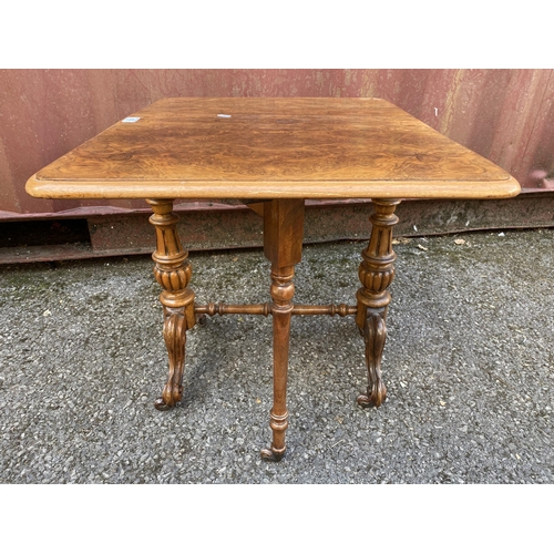 186 - A late Victorian figured walnut Sutherland table of small proportions, with twin fall flaps, twin ca... 