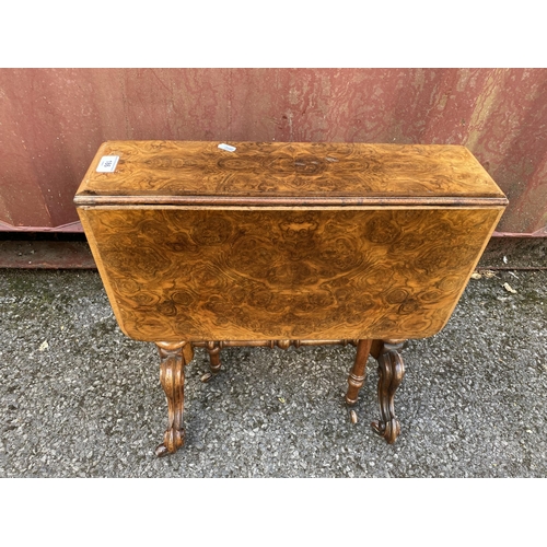 186 - A late Victorian figured walnut Sutherland table of small proportions, with twin fall flaps, twin ca... 