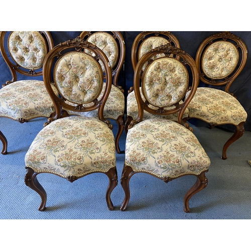 189 - A set of six late Victorian walnut salon chairs, with carved ornament, a button upholstered oval bac... 