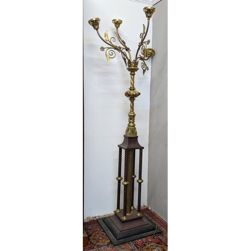 244 - A 19th century Ecclesiastical brass and cast iron floor standing candelabra, with four branches, col... 