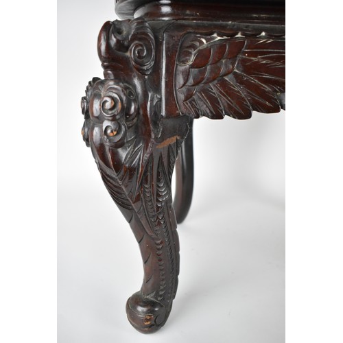 113A - A Chinese late 19th century carved wooden chair with a central panel of a dragon and clouds, the arm... 