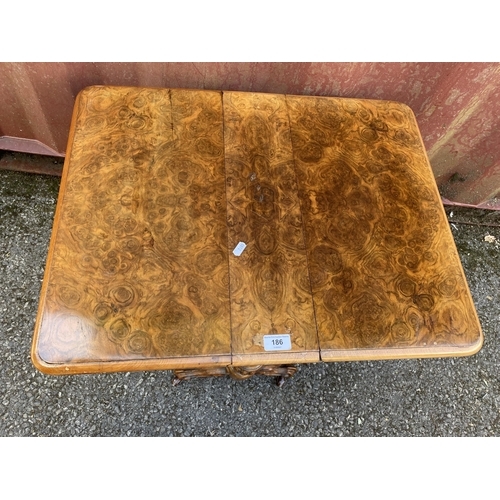 186 - A late Victorian figured walnut Sutherland table of small proportions, with twin fall flaps, twin ca... 