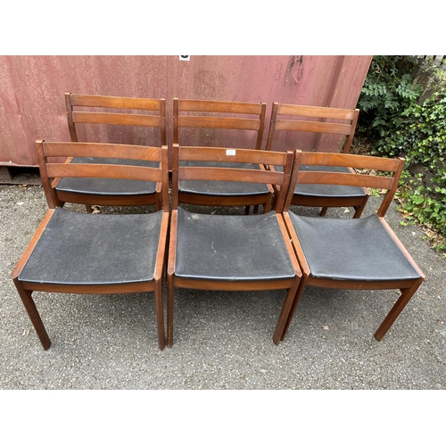 A White Newton 1960s teak extending dining table and six matching dining chairs the dining table