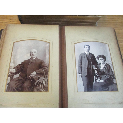 102 - A Victorian leather bound family photograph album with various portrait photographs, a Victorian fam... 