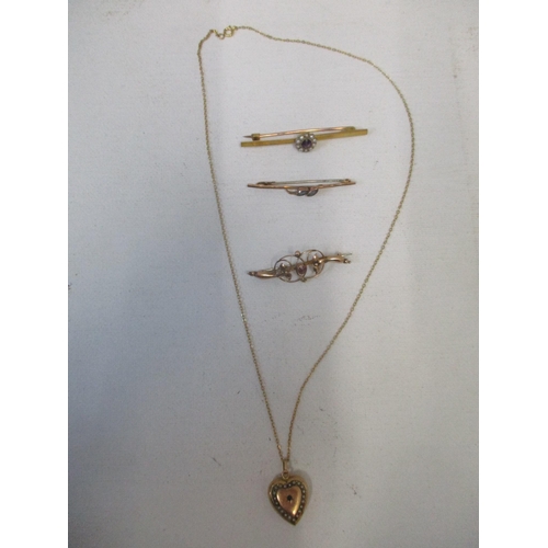 117 - A group of 9ct gold Victorian and Edwardian brooches, and a pendant, the heart-shaped pendant set wi... 