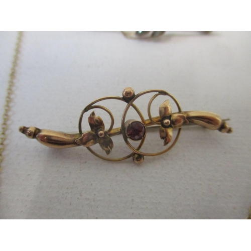 117 - A group of 9ct gold Victorian and Edwardian brooches, and a pendant, the heart-shaped pendant set wi... 