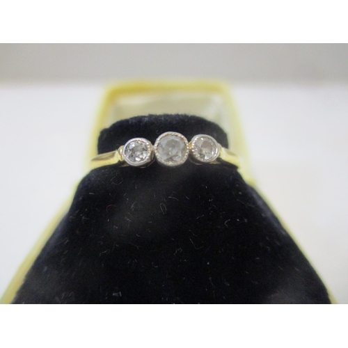 119 - An 18ct yellow gold three-stone diamond ring 2.45g total weight, in a Keystone Elgin ring box, and a... 