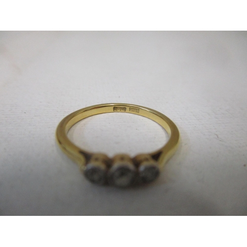 119 - An 18ct yellow gold three-stone diamond ring 2.45g total weight, in a Keystone Elgin ring box, and a... 