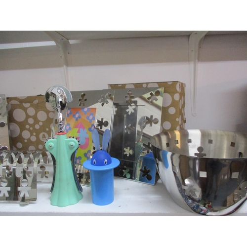 127 - Alessi goods, new in original packaging comprising photo frames, a toast rack, cork screws and other... 