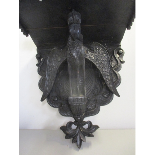 139 - A Black Forest style wooden wall bracket, the support below in the form of a carved mystical bird
Lo... 