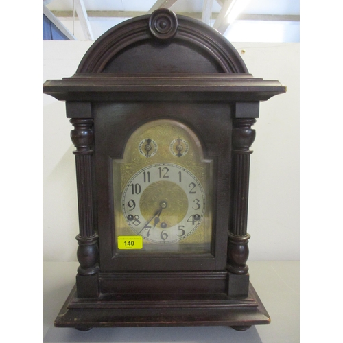 140 - An early 1920's mahogany cased and arched top, 8 day mantel clock, striking on five rods
Location: 7... 