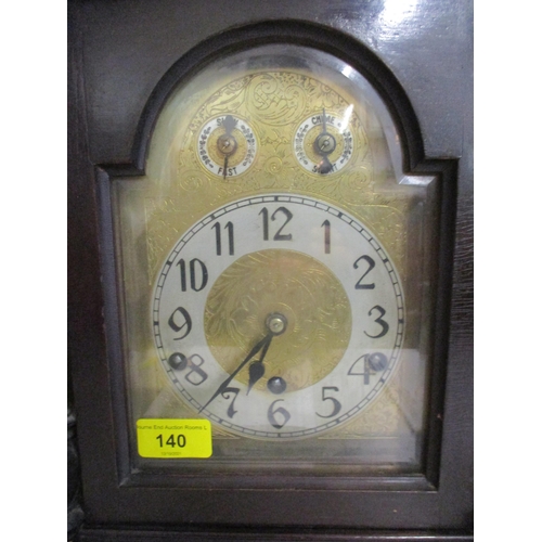 140 - An early 1920's mahogany cased and arched top, 8 day mantel clock, striking on five rods
Location: 7... 