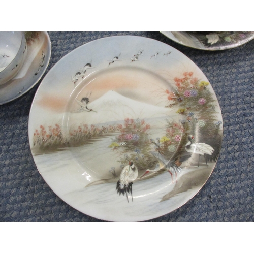 142 - A mixed lot to include a Japanese egg shell part tea set with images of storks, blue and white plate... 
