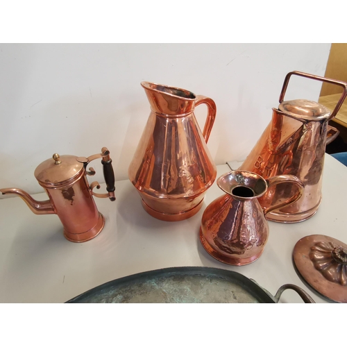 149 - Copperware to include two flagons, watering can, a lid by Benham & Sons, hot water pot and a large o... 