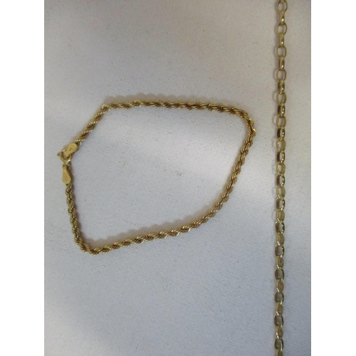 156 - A group of four 9ct gold chain necklaces, and a 9ct yellow gold rope twist bracelet, one necklace un... 