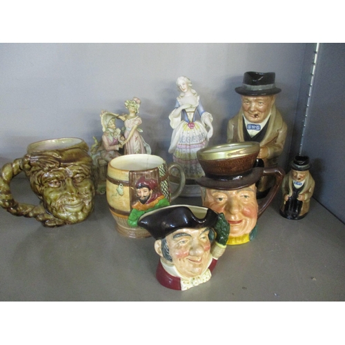172 - A group of ceramic character jugs and 19th century coloured bisque figurines to include Royal Doulto... 