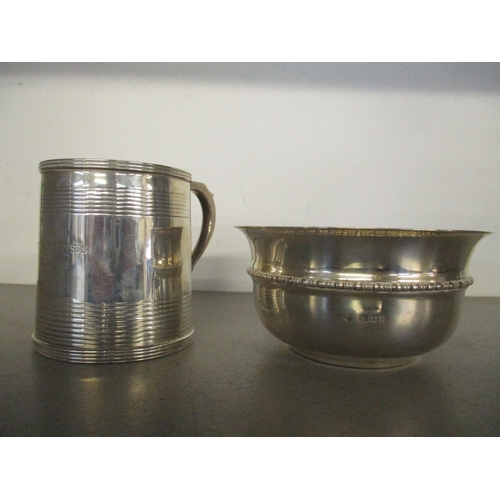 181 - A silver christening mug with horizontal banded decoration, engraved 'John Robertson 27 Jan 1909', B... 