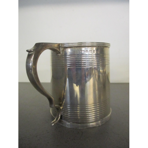181 - A silver christening mug with horizontal banded decoration, engraved 'John Robertson 27 Jan 1909', B... 